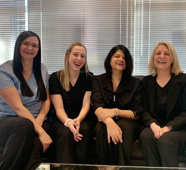 foothills dental care team sitting on couch